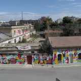 I murales sono stati disegnati nel 2014 all'interno dell'ex Caserma Rossani, sui tetti degli edifici che si affacciano su via Giulio Petroni